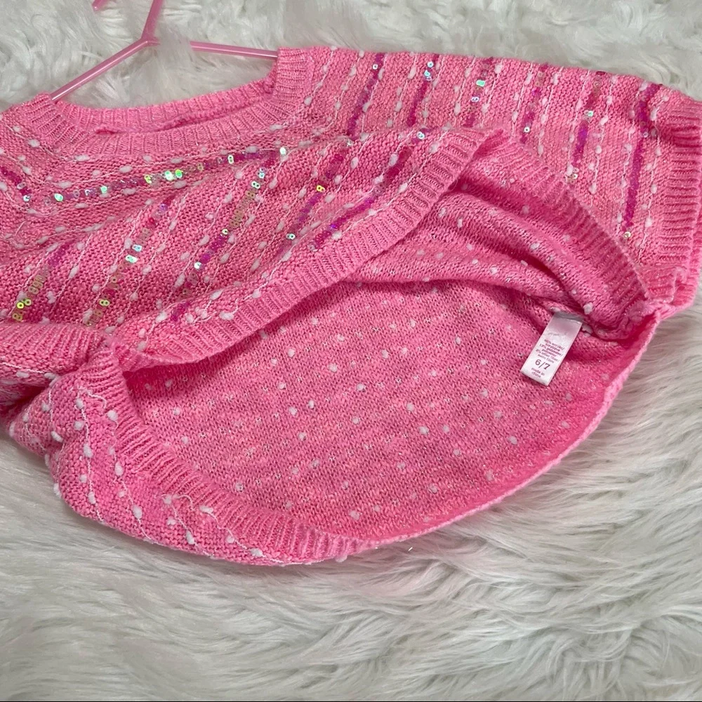 Justice pink sweater poncho with a sleeve iridescent sequins on front size 6/7